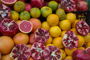 Oranges, pomegranates, grapefruits, mandarines fresh and colored