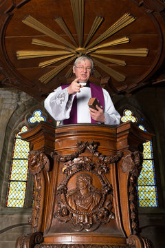 Antique pulpit and priest