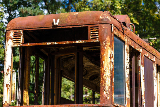 Old rusty destroyed wagon of tram.