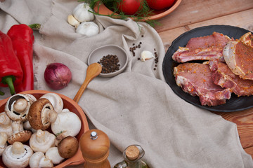 meat in a clay plate, champignon mushrooms and pepper. country style