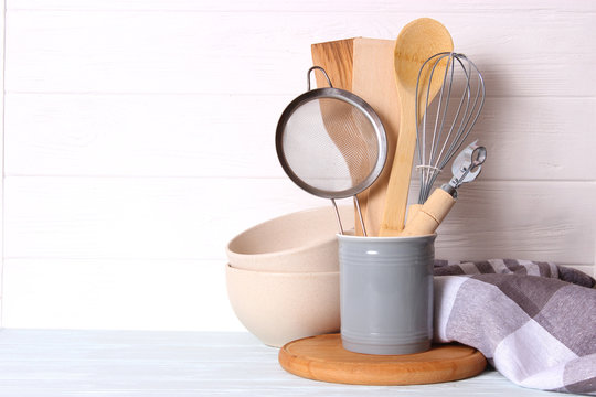 set of kitchenware on wooden background. Cooking appliances.