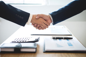 Handshake of two business people after contract agreement to become partner