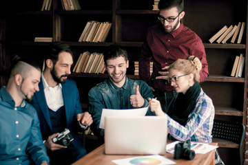 team of copywriters discussing a new advertising project