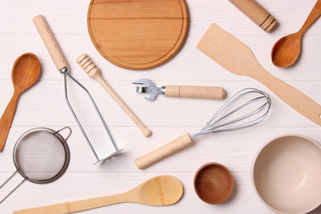 different kitchenware on a light background top view. Cooking appliances. flat lay 