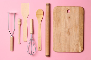 different kitchenware  on a colored background top view. Cooking appliances.