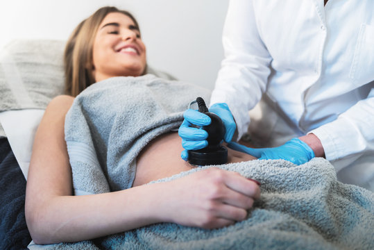 Female On Cavitation Treatment At Beauty Spa