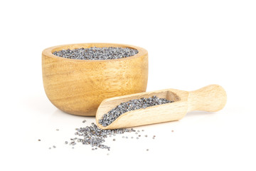 Lot of whole czech blue poppy seeds in a scoop with wooden bowl on white background