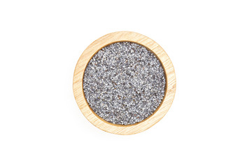 Lot of whole czech blue poppy seeds with wooden bowl flatlay isolated on white background