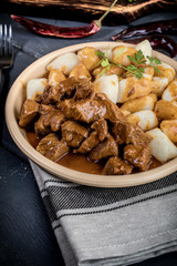 Beef stew with potatoes dumplings.