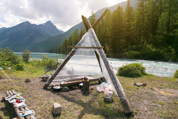 Awesome weatherproof shelter. The hut wigwam shelter for tourists in a hike in the wild. © ALEXEY