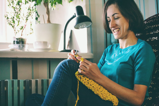 Woman knits crochet.