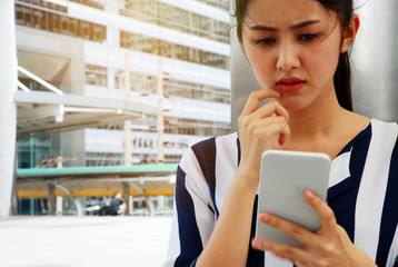 Beautiful woman smile portrait and talking mobile phone device. blur and retouch mobile phone device.