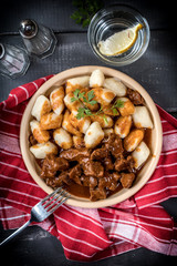 Beef stew with potatoes dumplings.