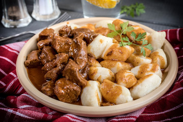 Beef stew with potatoes dumplings.