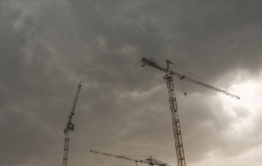 Milan, construction site with cranes, construction of buildings, Italy