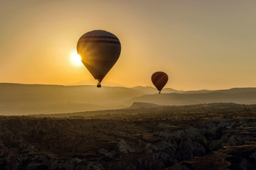 hot air balloons in sky at sunrise in Cappadocia