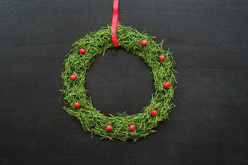Christmas wreath on blackboard
