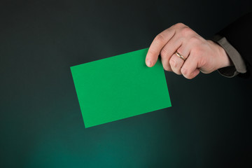 Businessman Holding a Green Card, Empty, Copy Space, Gradient Green background