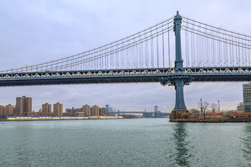 Fototapeta na wymiar Manhattan bridge from side and Williamsburg bridge on distance from Brooklyn, New York, USA