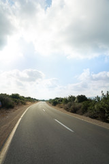 Fototapeta premium Blue sky and sunset above road