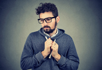 Man feeling embarrassed and looking away down