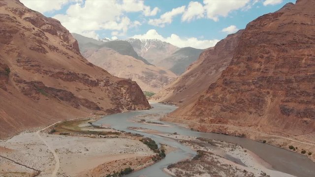 Areal Dron Shoot View of the Pamir, Afghanistan and Panj River Along the Wakhan Corridor. The Afghanistan-tajikistan Border. M41 Pamir Highway.
