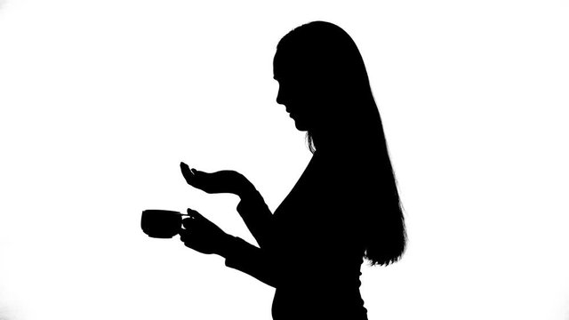 Footage of young woman taking the pills