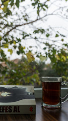 Tea and book on window 