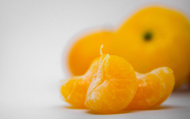 Orange is a fruit that can be eaten with anything delicious, orange on a white background, orange meat, milk, orange juice.