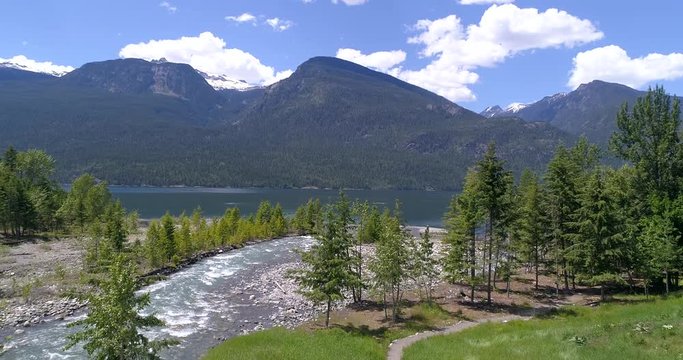 Majestic mountain river in Devis Creek, Vancouver, Canada. Drone flying. Aerial view with mountain background.