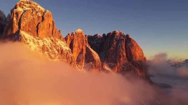 Aerial flight through mountain massive range. UHD outdoor footage