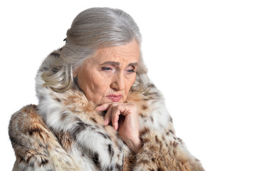portrait of beautiful senior woman in fur coat
