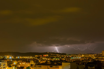 Naklejka premium Lightning in Sabadell city, Barcelona, Spain