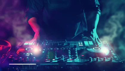 Fotobehang Party Night Club Disc Jockey (DJ) Entertainment with EDM Dance Music Mixer CD Players with Lighting and Smoke Effect During Holiday © DJ Creative Studio