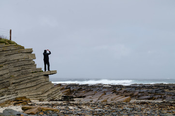 Person Looking Out to the Sea from Coast