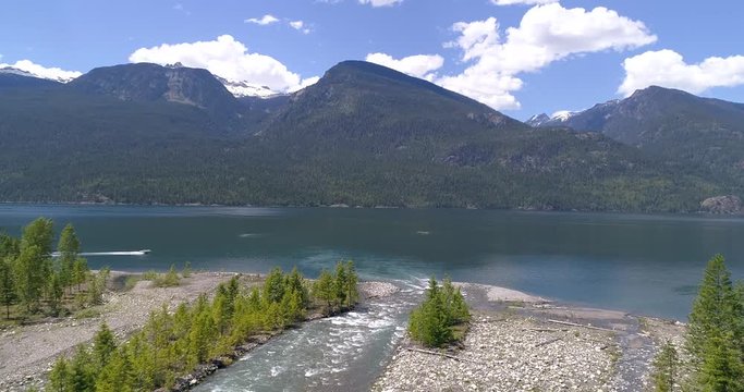 Majestic mountain river in Devis Creek, Vancouver, Canada. Drone flying. Aerial view with mountain background.