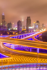 Fototapeta premium Traffic tracks in the downtown area of Shanghai at night