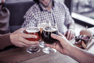Close up of male hands that touching bocals