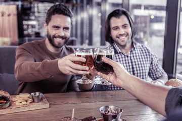 Handsome young bearded man communicating with friends