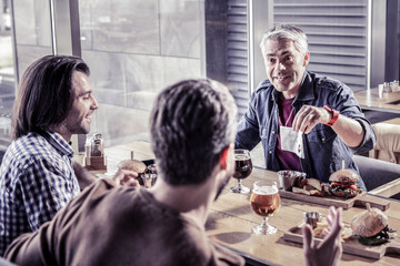 Obraz premium Handsome three males visiting teambuilding meetings together