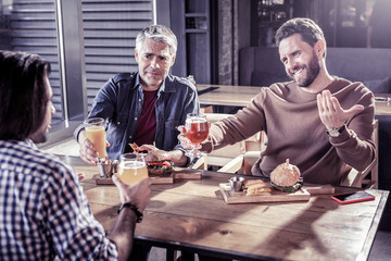 Emotional male person talking to his best friends