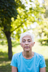 Portrait of senior woman in the park