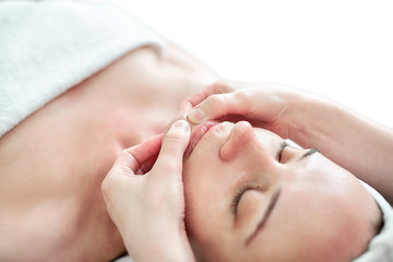 Face massage. Chin and hands closeup. Facial skin care. Woman at beauty spa salon. Cosmetology