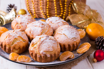 Homemade orange muffins on the wooden table