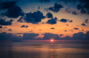 Naklejka na ściany i meble Aerial view of beautiful amazing sea sunset with color dramatic sky