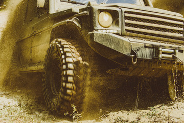 Motion the wheels tires and off-road that goes in the dust. Off-road vehicle goes on the mountain. Track on mud. 4x4 Off-road suv car. Offroad car. Safari. © Volodymyr