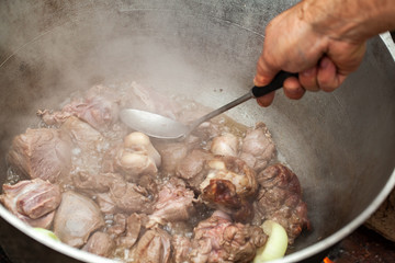 Preparing of Chorba soup on open fire