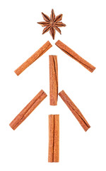 Christmas tree made from anise star seed and cinnamon sticks on a white background