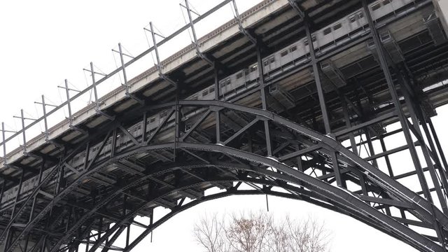 Bloor Viaduct with subway train passing. Winter in the Don Valley, Toronto, Canada.