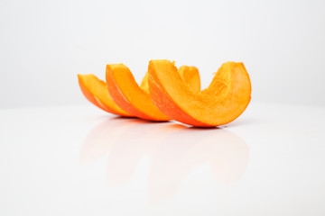 Sliced pumpkin on a white background